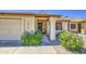 Inviting front entryway with a private two car garage and lush plants at 2845 E Irwin Ave, Mesa, AZ 85204