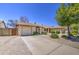 Charming single-story home with a well-manicured, low maintenance front yard and private two car garage at 2845 E Irwin Ave, Mesa, AZ 85204