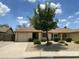 Charming single-story home with a well-manicured, low maintenance front yard and private two car garage at 2845 E Irwin Ave, Mesa, AZ 85204