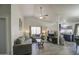 Bright and open living room featuring vaulted ceilings, neutral paint, wood-look floors, and large windows at 2845 E Irwin Ave, Mesa, AZ 85204