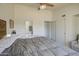Bright main bedroom featuring a ceiling fan, large closet and attached bathroom at 2845 E Irwin Ave, Mesa, AZ 85204