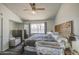 Relaxing bedroom features a wooden headboard, plush carpet, and large window at 2845 E Irwin Ave, Mesa, AZ 85204