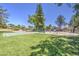 Community park featuring a basketball court, swing set, and green space for recreation at 2845 E Irwin Ave, Mesa, AZ 85204