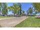 Outdoor volleyball court in a community park, surrounded by trees and green space at 2845 E Irwin Ave, Mesa, AZ 85204