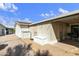 Covered patio and gravel backyard, offering ample outdoor space for relaxing and entertaining at 3301 S Goldfield Rd # 1010, Apache Junction, AZ 85119