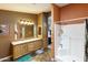 Bathroom with double sink vanity and a shower and tub combination at 3301 S Goldfield Rd # 1010, Apache Junction, AZ 85119