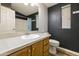 Bathroom featuring a single sink vanity and a framed mirror, paired with a toilet at 3301 S Goldfield Rd # 1010, Apache Junction, AZ 85119