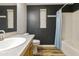 Bathroom with a single sink vanity, and a bathtub shower with a blue shower curtain at 3301 S Goldfield Rd # 1010, Apache Junction, AZ 85119