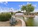 Scenic community entrance with water feature and lush landscaping at Dolce Vita at 3301 S Goldfield Rd # 1010, Apache Junction, AZ 85119