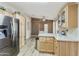 Bright kitchen with stainless steel refrigerator and light wood cabinets at 3301 S Goldfield Rd # 1010, Apache Junction, AZ 85119