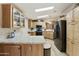 Spacious kitchen with granite counters, stainless steel appliances, and light wood cabinets at 3301 S Goldfield Rd # 1010, Apache Junction, AZ 85119