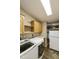 Laundry room area with washer, dryer, storage cabinets and additional storage at 3301 S Goldfield Rd # 1010, Apache Junction, AZ 85119