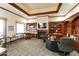 Resident office space with fireplace, a desk and lots of bookshelves for storing office files at 3301 S Goldfield Rd # 1010, Apache Junction, AZ 85119