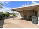 Covered back patio with desert landscaping and patio furniture at 3301 S Goldfield Rd # 1010, Apache Junction, AZ 85119