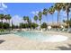 Community pool with palm trees, blue skies and plenty of seating on a sunny day at 3301 S Goldfield Rd # 1010, Apache Junction, AZ 85119