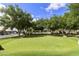 Practice your putting on this community putting green with mature shade trees and manicured lawn at 3301 S Goldfield Rd # 1010, Apache Junction, AZ 85119