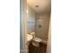 Bathroom with a vanity, toilet, and tiled shower with a rain shower head at 4049 N 81St Ave, Phoenix, AZ 85033