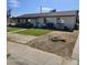 A charming single-story home with a well-manicured lawn at 4049 N 81St Ave, Phoenix, AZ 85033