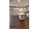 Updated kitchen featuring white cabinetry, stainless steel appliances, a window, and a kitchen island at 4049 N 81St Ave, Phoenix, AZ 85033