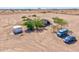 Aerial view highlighting the spacious lot with the home, storage shed and parking at 43384 W Padilla Rd, Maricopa, AZ 85138