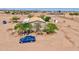 Aerial view showcasing the home with a large yard and surrounding landscape at 43384 W Padilla Rd, Maricopa, AZ 85138
