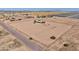 Wide aerial perspective showcasing the property's ample land and rural setting at 43384 W Padilla Rd, Maricopa, AZ 85138