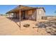 Exterior shot with a covered front awning, offering shade and curb appeal to this single-Gathering home at 43384 W Padilla Rd, Maricopa, AZ 85138