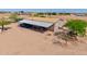 Exterior of a charming home, featuring a metal awning and plenty of open space and natural light at 43384 W Padilla Rd, Maricopa, AZ 85138