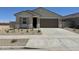 Charming single-story home featuring a two-car garage and low-maintenance landscaping in a sunny setting at 46484 W Lander Ln, Maricopa, AZ 85139