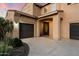 Stunning two-story home featuring meticulously landscaped front yard, attached garage, and covered front entryway at 5123 S Mariposa Dr, Gilbert, AZ 85298