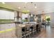 Spacious kitchen features a center island with bar seating, stainless steel appliances, and ample cabinet storage at 5123 S Mariposa Dr, Gilbert, AZ 85298