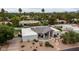 Aerial view of home showcasing landscaping, unique architecture, desert surroundings, and neighborhood at 5438 E Lupine Ave, Scottsdale, AZ 85254