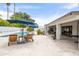 Backyard showcases a sparkling pool, lounge chairs, mature trees, and a covered patio, perfect for outdoor living at 5438 E Lupine Ave, Scottsdale, AZ 85254