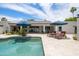 Lush backyard with pool, patio, lounge chairs, and beautiful landscaping provides a serene outdoor escape at 5438 E Lupine Ave, Scottsdale, AZ 85254