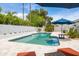 Refreshing pool with travertine tile deck provides a serene space for relaxation and outdoor enjoyment at 5438 E Lupine Ave, Scottsdale, AZ 85254