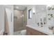 Sleek bathroom featuring a glass-enclosed shower and modern vanity with light fixture at 5438 E Lupine Ave, Scottsdale, AZ 85254