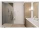 Bright bathroom featuring glass enclosed shower, and vanity with light wood cabinetry at 5438 E Lupine Ave, Scottsdale, AZ 85254
