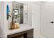 Bright bathroom with a modern vanity, decorative accents, and a view into the shower at 5438 E Lupine Ave, Scottsdale, AZ 85254