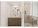 Modern bathroom featuring a glass-enclosed shower and quartz countertop vanity at 5438 E Lupine Ave, Scottsdale, AZ 85254