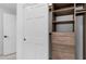 Organized walk-in closet with custom shelving, drawers, and ample storage space at 5438 E Lupine Ave, Scottsdale, AZ 85254