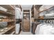 Walk-in closet with built-in shelving, hanging rods, drawers, and ample storage space at 5438 E Lupine Ave, Scottsdale, AZ 85254