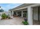 Inviting covered patio with comfortable seating, lush landscaping, and seamless indoor-outdoor flow at 5438 E Lupine Ave, Scottsdale, AZ 85254
