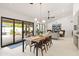 Open dining space with direct access to the backyard and pool area, featuring modern furnishings and ample light at 5438 E Lupine Ave, Scottsdale, AZ 85254