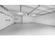 Clean garage with epoxy flooring, ample space, and good lighting at 5438 E Lupine Ave, Scottsdale, AZ 85254