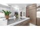 Modern kitchen features a center island cooktop, sleek cabinetry, and stainless steel appliances at 5438 E Lupine Ave, Scottsdale, AZ 85254