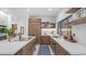 Well-lit kitchen featuring sleek countertops, stainless steel appliances, and stylish wooden cabinets at 5438 E Lupine Ave, Scottsdale, AZ 85254