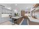 Bright kitchen showcasing stylish gray cabinets, a center island with cooktop, and modern stainless appliances at 5438 E Lupine Ave, Scottsdale, AZ 85254
