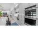 Spacious kitchen featuring stainless steel appliances, custom cabinetry, and open layout leading to dining area at 5438 E Lupine Ave, Scottsdale, AZ 85254