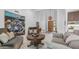 Inviting living room with a modern light fixture, neutral decor, and an open view of the home's entrance at 5438 E Lupine Ave, Scottsdale, AZ 85254