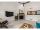 Bright living room featuring a fireplace, modern decor, and comfortable seating at 5438 E Lupine Ave, Scottsdale, AZ 85254
